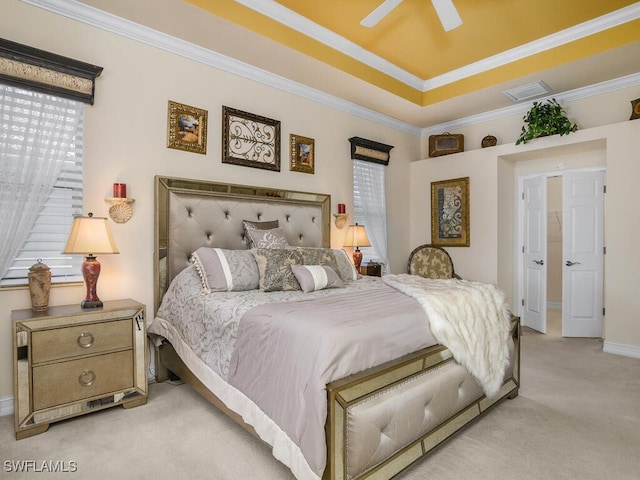 carpeted bedroom featuring crown molding and ceiling fan