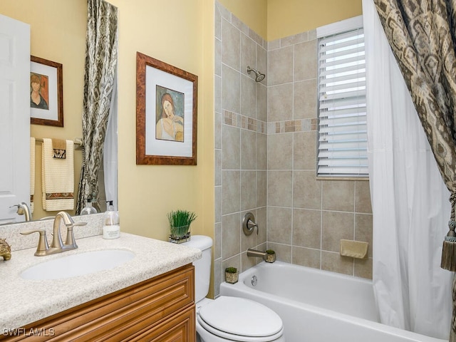 full bathroom featuring shower / tub combo, vanity, and toilet