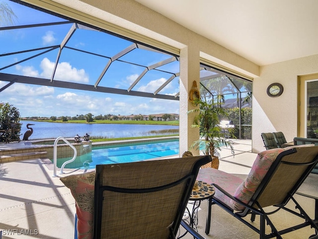 view of swimming pool with a lanai, a water view, and a patio