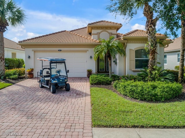 mediterranean / spanish-style home featuring a garage