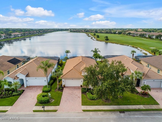 birds eye view of property with a water view