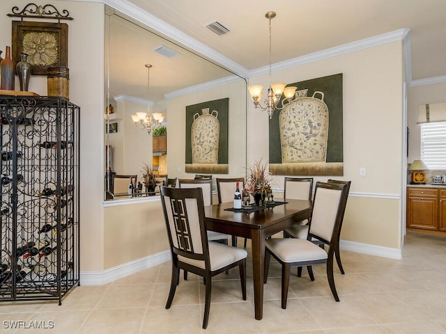 dining area featuring ornamental molding, light tile patterned flooring, and a chandelier