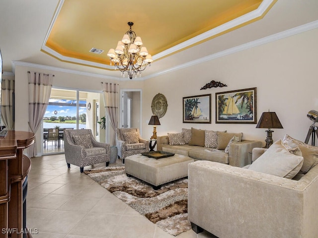 tiled living room featuring crown molding, a tray ceiling, and an inviting chandelier