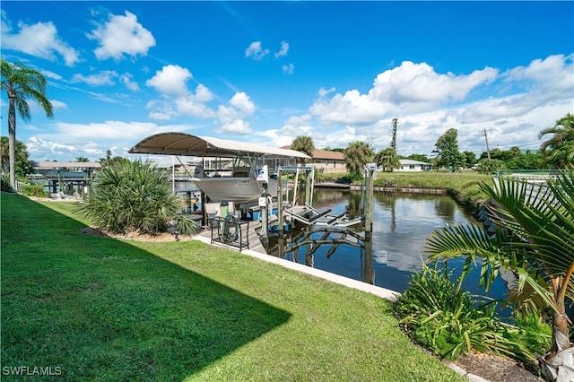 dock area featuring a water view and a yard