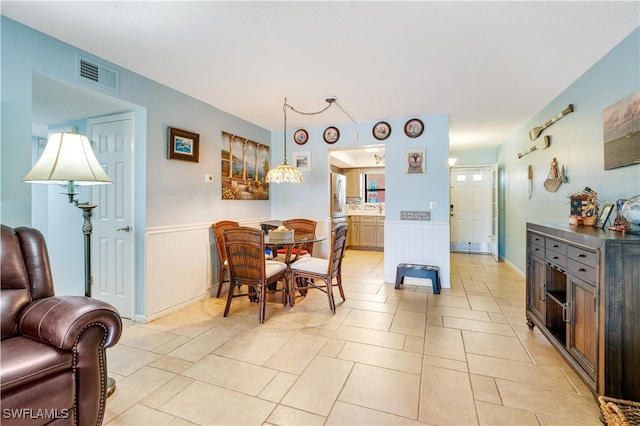 dining area featuring light tile patterned floors