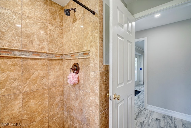 bathroom with a tile shower