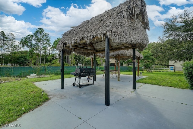 view of home's community featuring a patio, a gazebo, and a yard