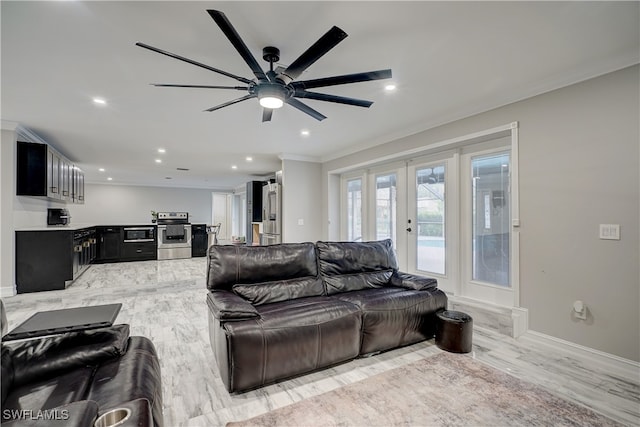 living room with crown molding, ceiling fan, french doors, and light hardwood / wood-style flooring