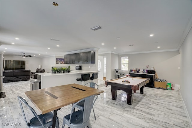 dining space with pool table, ornamental molding, and ceiling fan