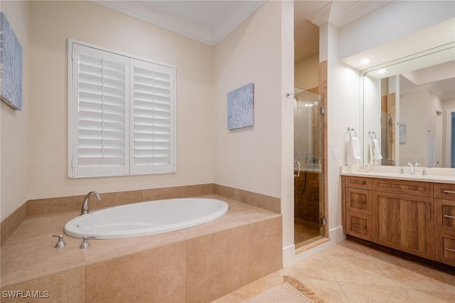 bathroom with vanity, crown molding, tile patterned floors, and independent shower and bath