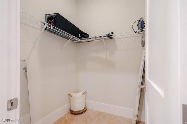 walk in closet featuring tile patterned floors