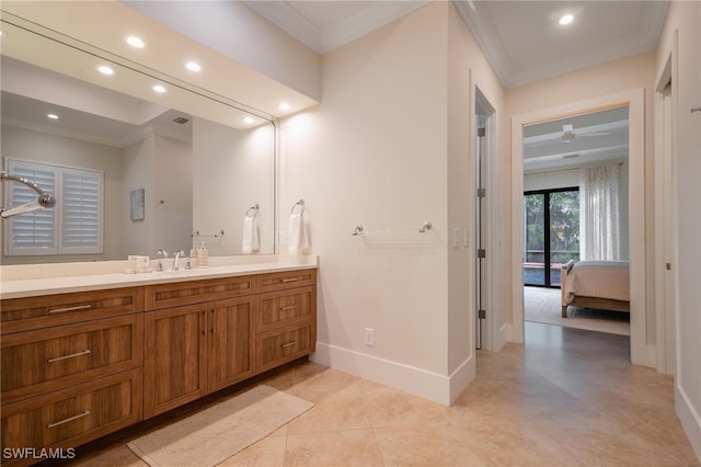 bathroom featuring vanity, crown molding, and tile patterned floors