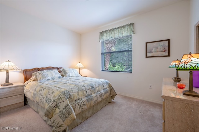 bedroom with light carpet