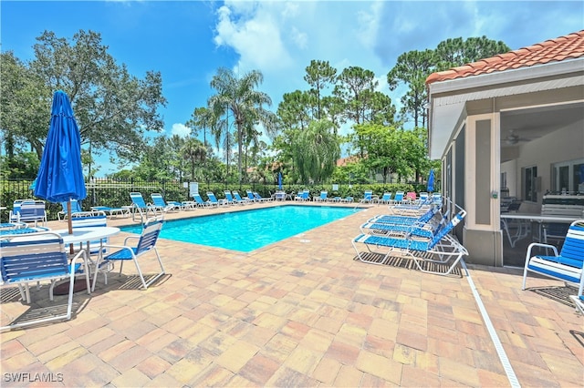 view of swimming pool with a patio area