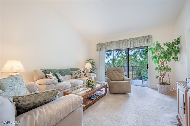 carpeted living room featuring high vaulted ceiling