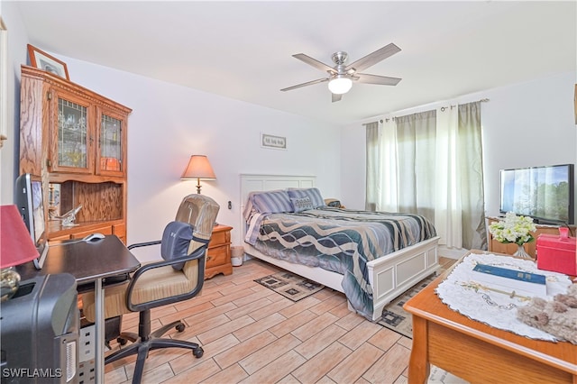 bedroom featuring light wood-type flooring and ceiling fan