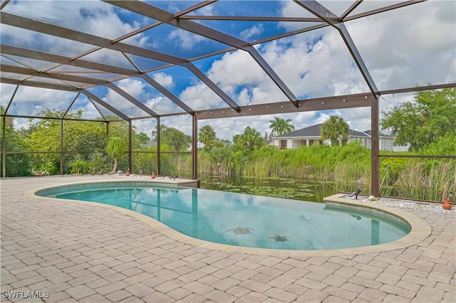 view of swimming pool featuring a lanai and a patio area