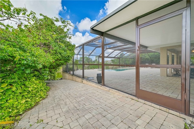 view of patio with a lanai