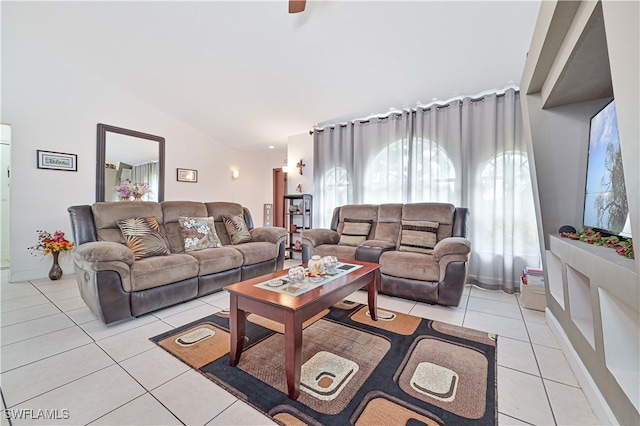 tiled living room featuring lofted ceiling