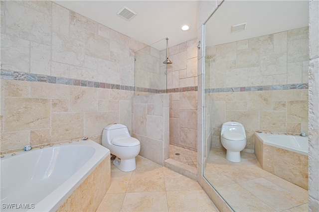 bathroom with separate shower and tub, tile walls, toilet, and tile patterned floors