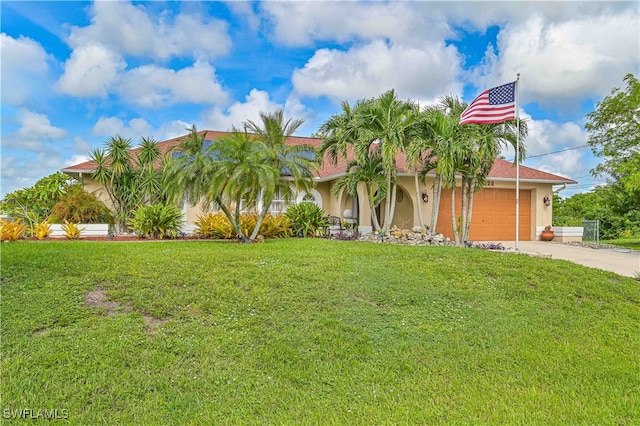 view of front of house featuring a front lawn and a garage