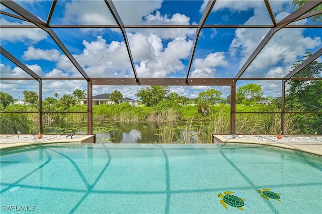 view of pool featuring a water view and a lanai