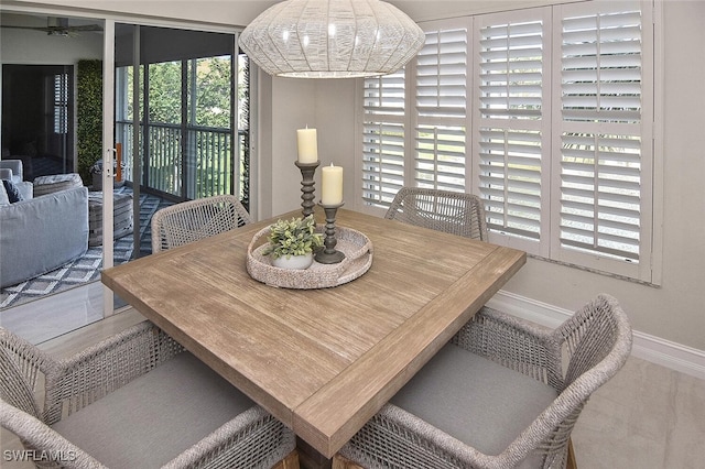 dining area featuring ceiling fan and plenty of natural light