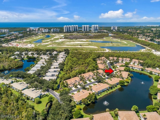 bird's eye view with a residential view, a water view, and view of golf course
