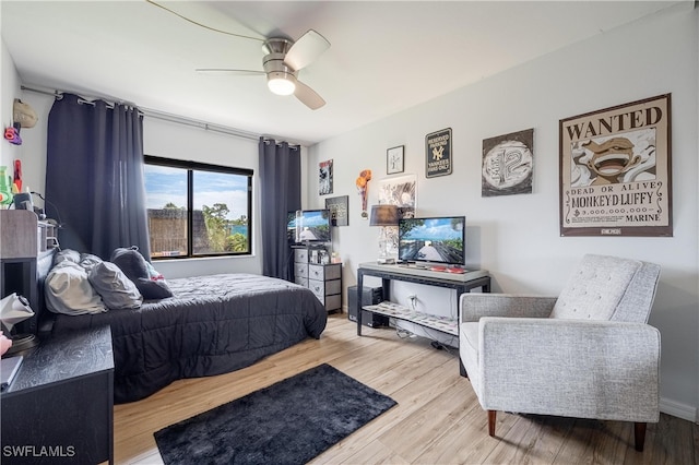 bedroom featuring ceiling fan and hardwood / wood-style flooring