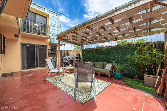 view of patio with an outdoor hangout area, a balcony, and a pergola