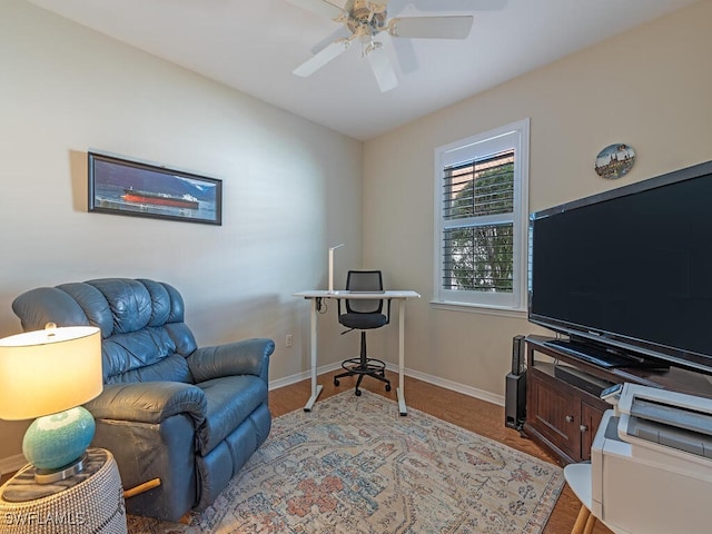 living area with ceiling fan