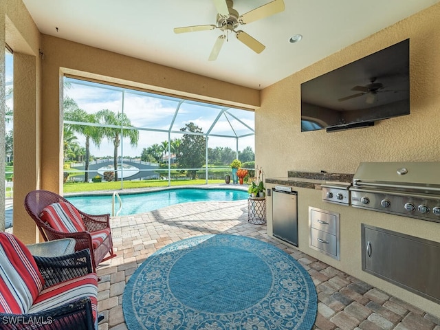 view of pool featuring ceiling fan and grilling area