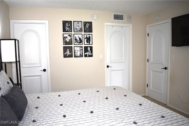 bedroom featuring a textured ceiling