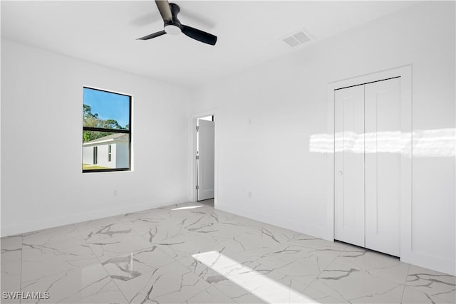 empty room featuring ceiling fan