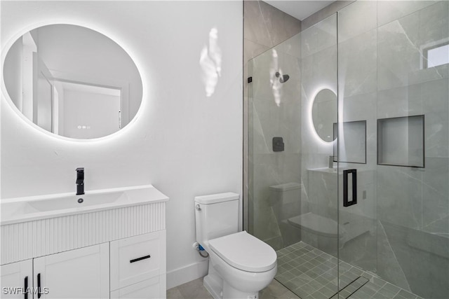 bathroom with tile patterned flooring, vanity, toilet, and a shower with shower door