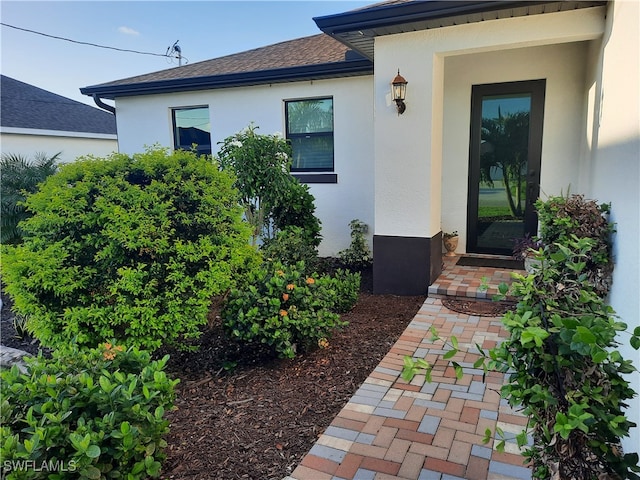 entrance to property with a patio area