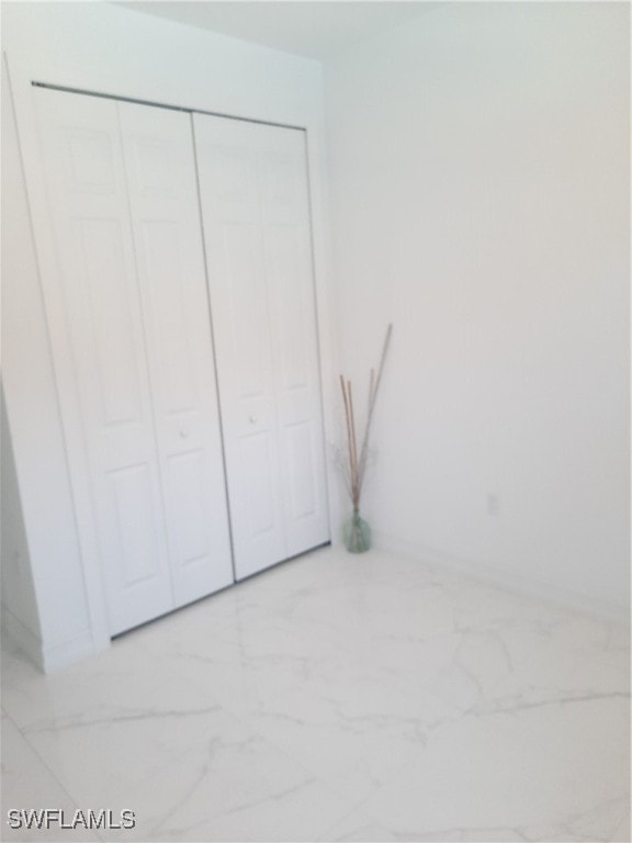 unfurnished bedroom featuring a closet