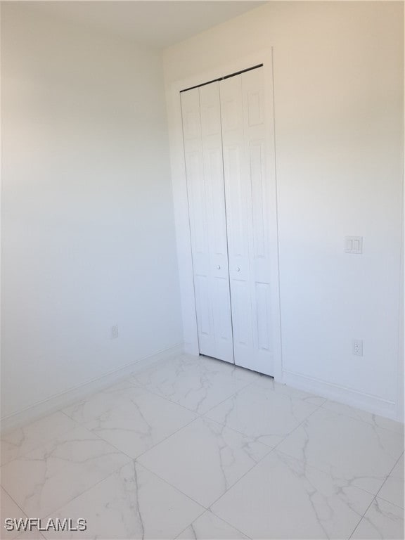 unfurnished bedroom featuring a closet