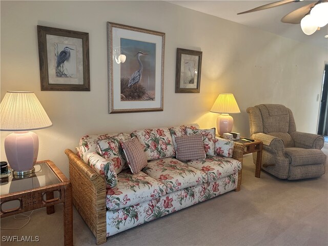 carpeted living room featuring ceiling fan