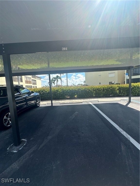 view of parking / parking lot featuring a carport