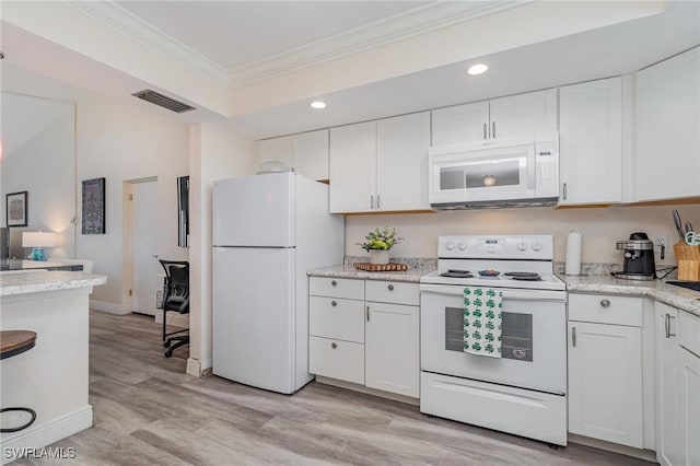 kitchen with white cabinetry, crown molding, light stone counters, light wood-type flooring, and white appliances