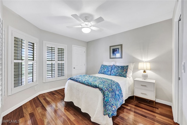 bedroom featuring dark wood-type flooring and ceiling fan