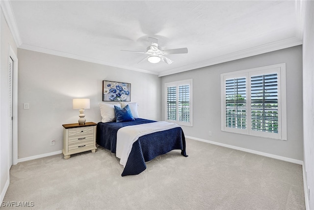 bedroom with light colored carpet, ceiling fan, and crown molding