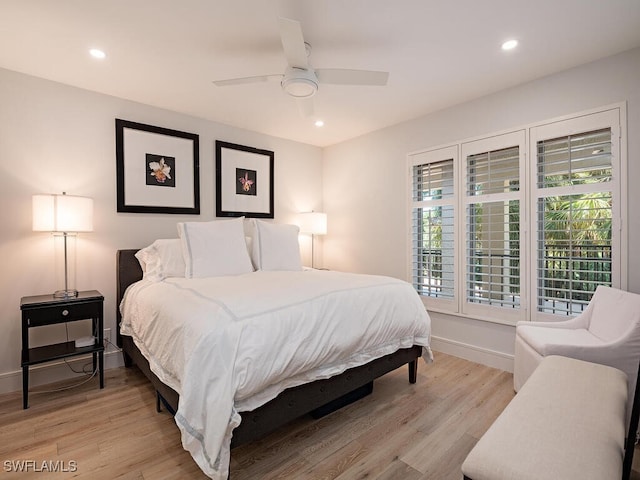 bedroom featuring ceiling fan and light hardwood / wood-style flooring