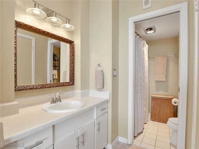 bathroom featuring tile patterned floors, vanity, curtained shower, and toilet