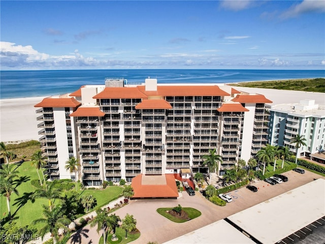 view of property featuring a water view and a view of the beach