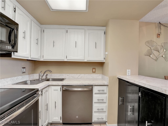 kitchen featuring sink, white cabinetry, and stainless steel appliances