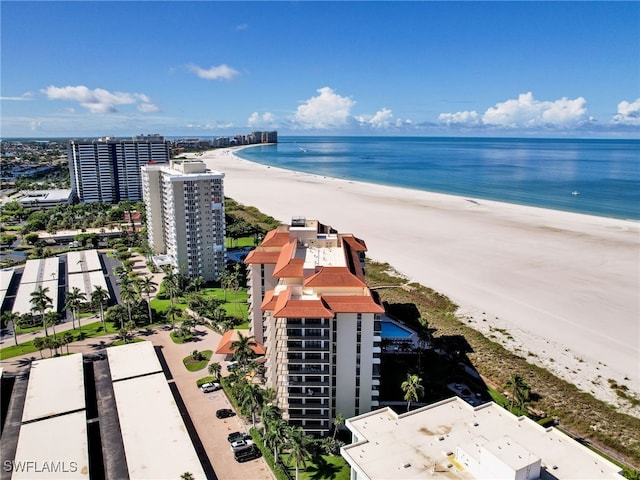 drone / aerial view featuring a view of the beach and a water view