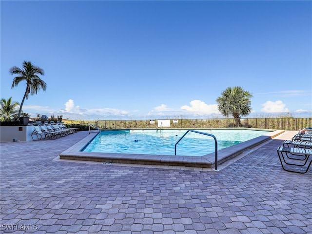 view of pool featuring a patio