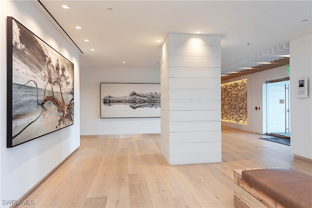 corridor featuring light hardwood / wood-style floors